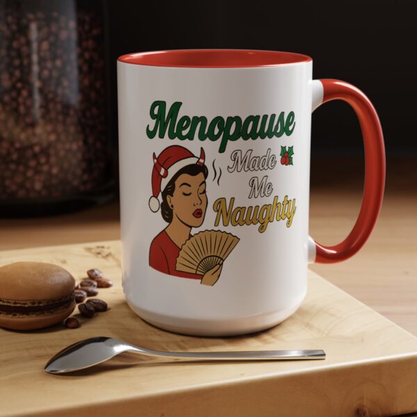 Menopause Made Me Naughty Christmas Mug by Mean and Menopausal — white ceramic holiday mug with colorful interior, retro woman design, and sassy festive quote.