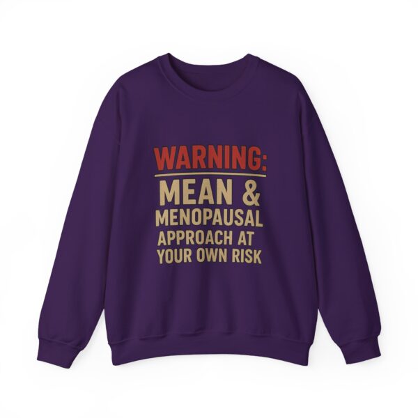 “Warning: Mean and Menopausal – Approach at Your Own Risk” sweatshirt, a cozy and funny statement piece for women embracing perimenopause with humor and attitude.
