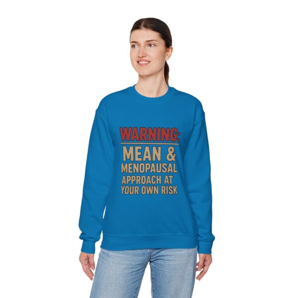 “Warning: Mean and Menopausal – Approach at Your Own Risk” sweatshirt, a cozy and funny statement piece for women embracing perimenopause with humor and attitude.