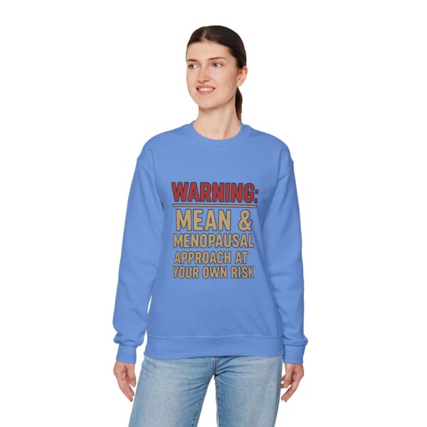 “Warning: Mean and Menopausal – Approach at Your Own Risk” sweatshirt, a cozy and funny statement piece for women embracing perimenopause with humor and attitude.