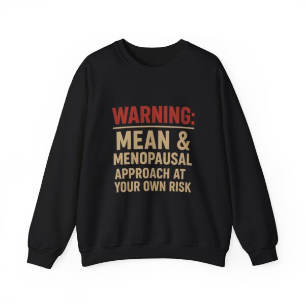 “Warning: Mean and Menopausal – Approach at Your Own Risk” sweatshirt, a cozy and funny statement piece for women embracing perimenopause with humor and attitude.