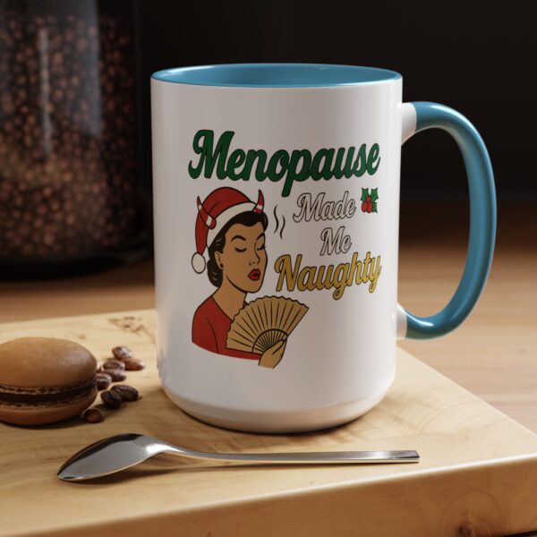 Menopause Made Me Naughty Christmas Mug by Mean and Menopausal — white ceramic holiday mug with colorful interior, retro woman design, and sassy festive quote.