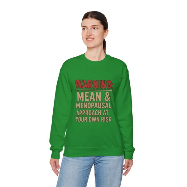 “Warning: Mean and Menopausal – Approach at Your Own Risk” sweatshirt, a cozy and funny statement piece for women embracing perimenopause with humor and attitude.