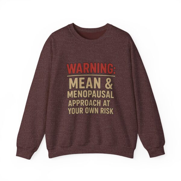 “Warning: Mean and Menopausal – Approach at Your Own Risk” sweatshirt, a cozy and funny statement piece for women embracing perimenopause with humor and attitude.