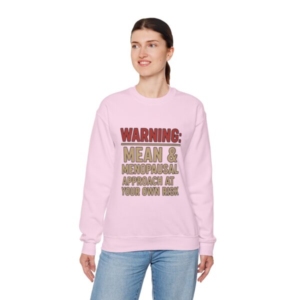“Warning: Mean and Menopausal – Approach at Your Own Risk” sweatshirt, a cozy and funny statement piece for women embracing perimenopause with humor and attitude.